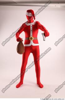 JOEL_ADAMSON CHRISTMAS VALLAIN WITH GUN AND BAG